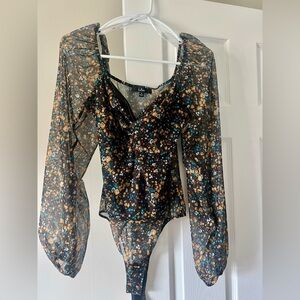 Size Small Black Floral Bodysuit with Mesh Sleeves.